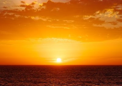 body of water during sunset